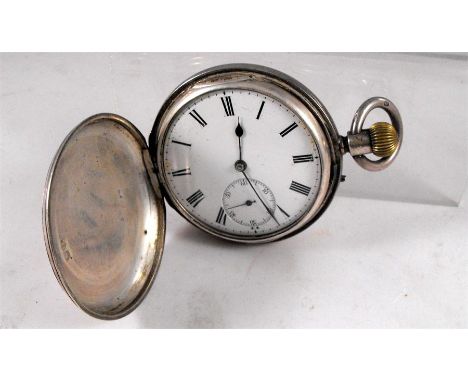 A Victorian Hunter pocket watch the enamel dial having Roman numerals and subsidiary seconds in a silver case, London 1889 5c