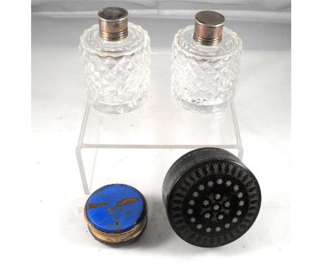 A pair of French white metal mounted cut glass scent bottles, a Georgian horn patch box and  a gilt metal patch box (A/F) (4)