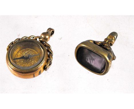 A Victorian gold plated swivel compass fob and a seal fob (2)