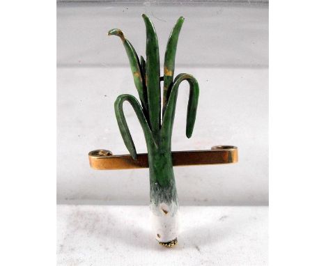 An unusual antique enamelled Leek 9ct gold brooch 4.5cm high Condition ReportSome chipping to the enamel, the tip of the left