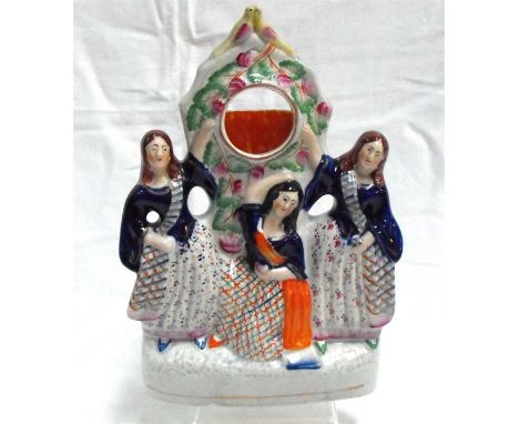 A Victorian Staffordshire flat back watch holder, lovebirds and Scottish figures 28cm high Condition ReportThere are no chips