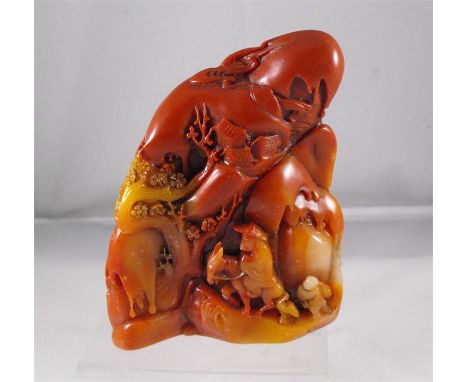 A chinese carved soapstone boulder, figures in a rocky landscape 12cm high 