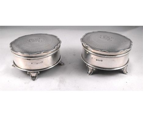 A pair of circular silver trinket boxes, Birmingham 1920, initialled 8cm diameter 