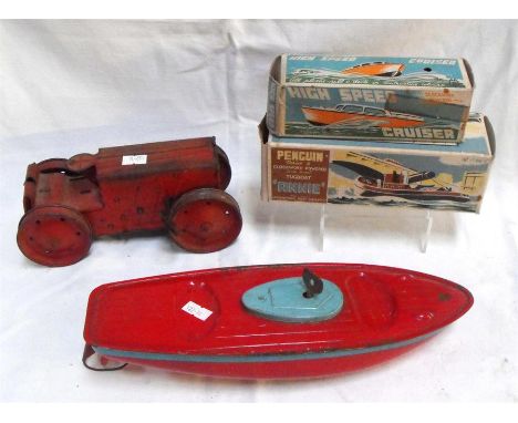 A Tri-ang tin plate clock work boat 31cm a tri-ang tractor No.2 a penguin series 4 clock work "Annie" tug boat boxed, and ano
