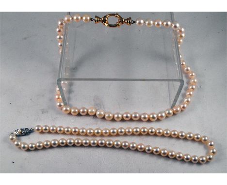 A pearl necklace with silver clasp 35cm long and another similar 41cm long 