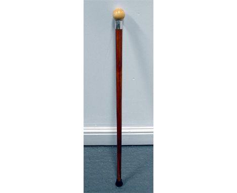 A Malacca walking stick with turned ivory ball handle and white metal collar 85cm high  