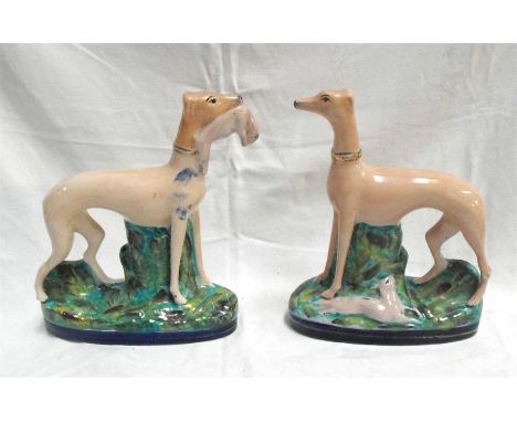 A pair of Staffordshire standing greyhounds with rabbits 24.5cm high Condition Report&middot;&nbsp;&nbsp;&nbsp;&nbsp;&nbsp;&n