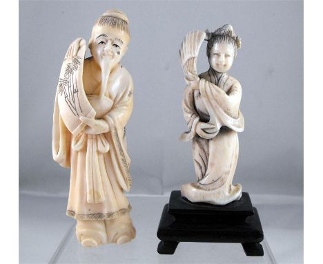 An early 20thC Chinese Ivory figure, a robed woman holding a fan 7.5cm high and another similar, a robed man holding a scroll