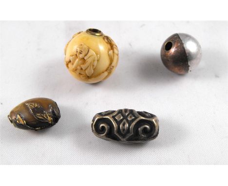 Four Japanese Ojime beads for netsuke cord including a mixed metal peach and an ivory ball carved with figures (4) 