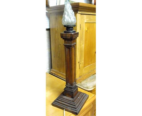A mahogany table lamp with square column on a stepped base with a frosted glass flame shade 62cm high 