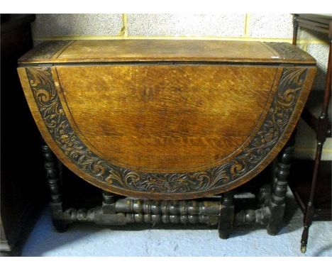 An 18thC oak gateleg table with bobbin turned legs 88cm wide 