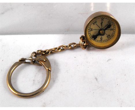 A 9ct gold fob compass decorated Saint Christopher 1.5cm diameter 