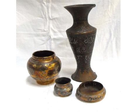 An Islamic Cairo Ware brass vase with copper and silver inlay (lacks base) 28cm high and three similar bowls (4) 