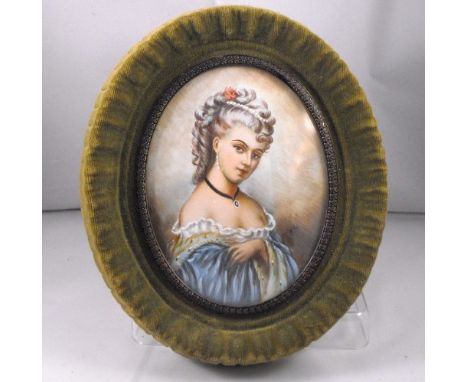 A portrait miniature of a young woman wearing a blue dress 9cm x 12cm 