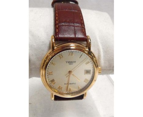 An 18ct Tissot gentleman's automatic wrist watch with Roman numerals and date aperture No. G666330, boxed, Condition ReportIt