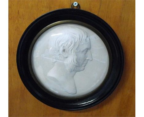 A 19thC circular plaster bust portrait of a gentleman signed Piglalles 16cm diameter 