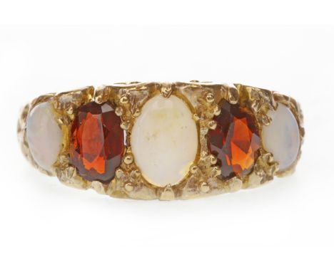 VICTORIAN STYLE NINE CARAT GOLD GARNET AND OPAL RING
the boat shaped setting with faceted garnets interspaced by oval opals, 