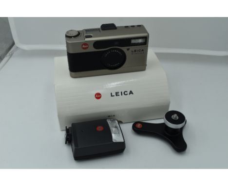 A Leica Minilux Compact Camera, titanium, serial no. 2145366, with Leitz Summarit f/2.4 40mm lens. In original packaging with