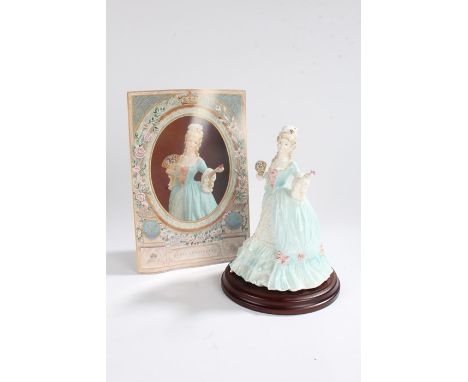 Coalport figure, Marie Antoinette, from the Femmes Fatales series, numbered 315/12,500, on a wooden plinth base 24cm high,wit