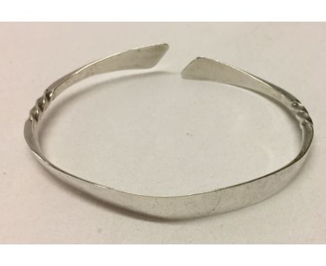 A hallmarked silver torque bangle.