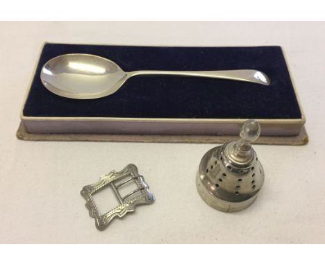 3 silver items comprising: boxed caddy spoon hallmarked Sheffield 1923, small engraved buckle hallmark Birmingham 1914 and a 