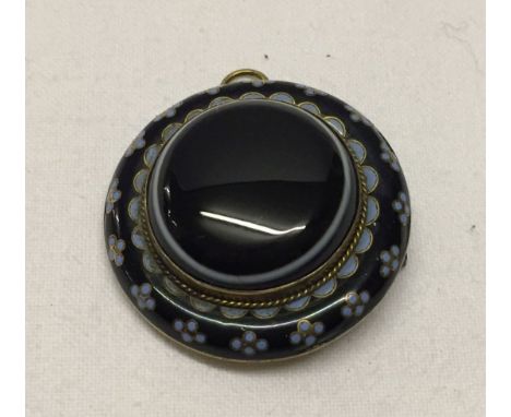 A Victorian mourning pendant/brooch. Navy and pale blue enamel to outside, middle a banded agate. Approx 3.5cm diamante. Pin 
