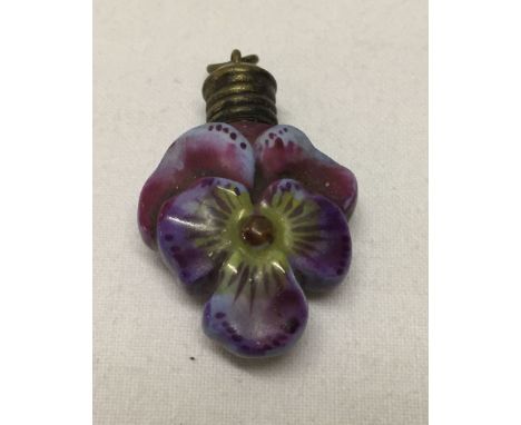 A small vintage ceramic scent bottle in the shape of a viola flower. With bale attached for use as a pendant or from a chatel