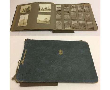 A 1930s photo album to include militaria, vintage cars, aircraft and African scenes.