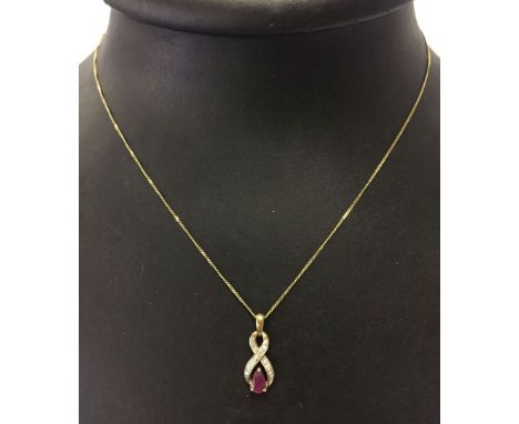 9ct gold ruby and diamond pendant on a 9ct gold chain. Total weight approx 1.4g.