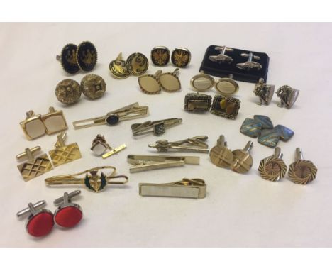 A quantity of cufflinks and tie pins to include Strattons.