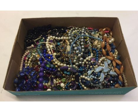 A box containing a large quantity of vintage and modern costume jewellery, mostly beaded necklaces.