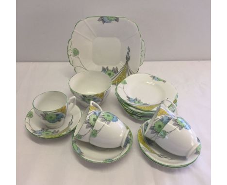 A Melba part tea set, comprising: sandwich plate, 6 side plates, 5 cups, 6 saucers and a sugar bowl