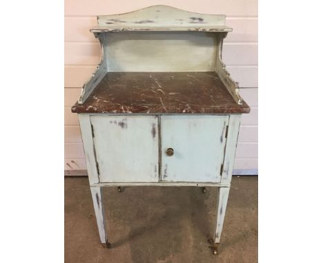 A shabby chic painted vintage marble top wash stand with brass castor feet, 61cm wide, 102cm high approx.