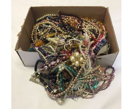 A box containing a large quantity of vintage and modern costume jewellery.