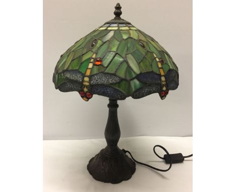 A Tiffany style lamp with dragonfly design lampshade.