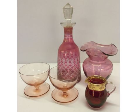 5 pieces of cranberry glass comprising: decanter, 2 sundae dishes, vase and a gilt collared jug.