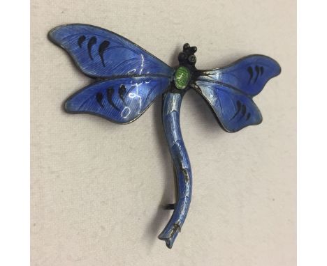 A silver and enamel dragonfly brooch, 5cm wide. Has JA&S mark for John Atkins and Son.