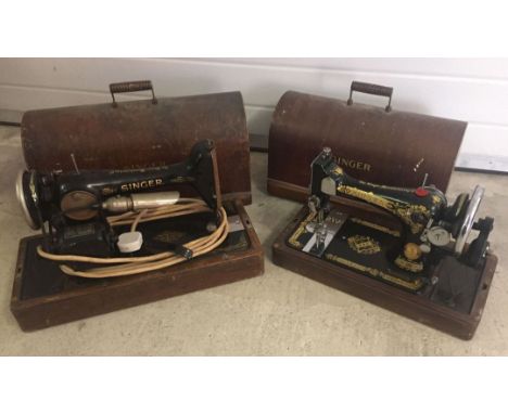 2 vintage cased Singer sewing machines.  One has been converted to electric.