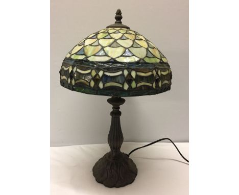A Tiffany style lamp with leaded glass lampshade.