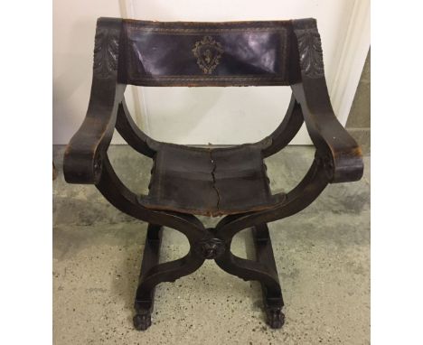 A vintage throne style chair with leather seat (seat in need of repair).