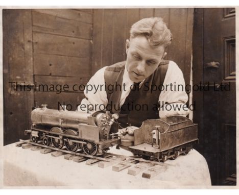 WILF LAWTON / WOLVES       An 8.5" X 6.5" black &amp; white photograph of the Wolves captain with a model engine which he com