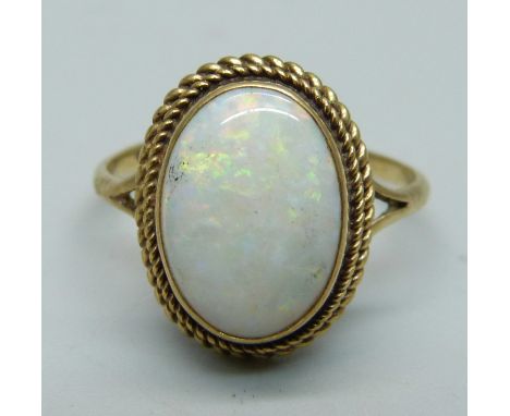 A 9ct gold and opal solitaire ring, 3.1g, S 