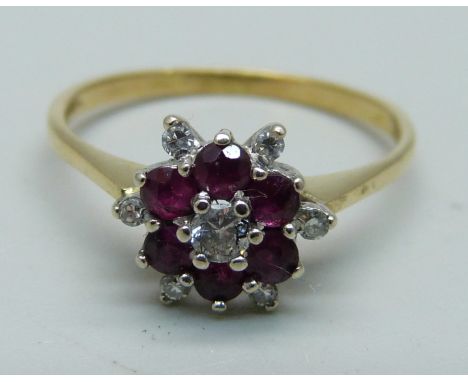 An 18ct gold ruby and diamond cluster ring, 2.3g, P 