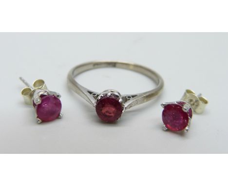 An 18ct gold and platinum set ruby solitaire ring with a pair of 9ct gold and ruby earrings, ring 2.4g, size P and lacking on