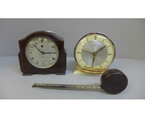A Smiths Bakelite mantel clock, Metamec electric clock and a Bakelite tape measure 