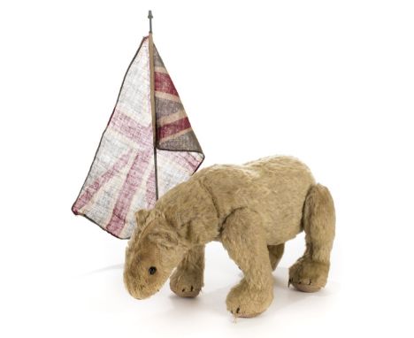 *Steiff. Polar Bear, Germany, circa 1910,  stuffed mohair polar bear with jointed limbs, elongated neck, boot button eyes, an