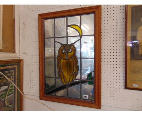 A lead light framed owl picture