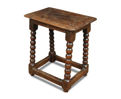 A James II oak joint stool, on bobbin turned and stretchered supports 52 x 48 x 30cm (20 x 19 x 12in) 