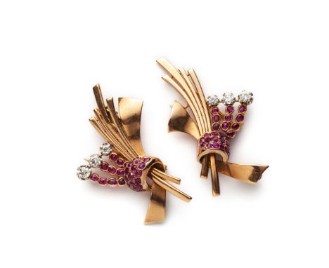 A pair of ruby and diamond dress clips, the mirror image clips designed as a loose bunch of polished stems gathered by a ruby