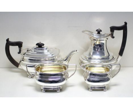 A silver four piece teaset, by Mappin & Webb, Sheffield 1919, comprising:- a teapot of compressed rectangular shape with moul